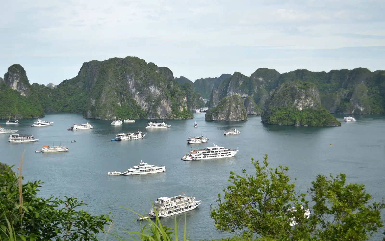 Cruise boats among the limestone islands of Ha Long Bay, Vietnam